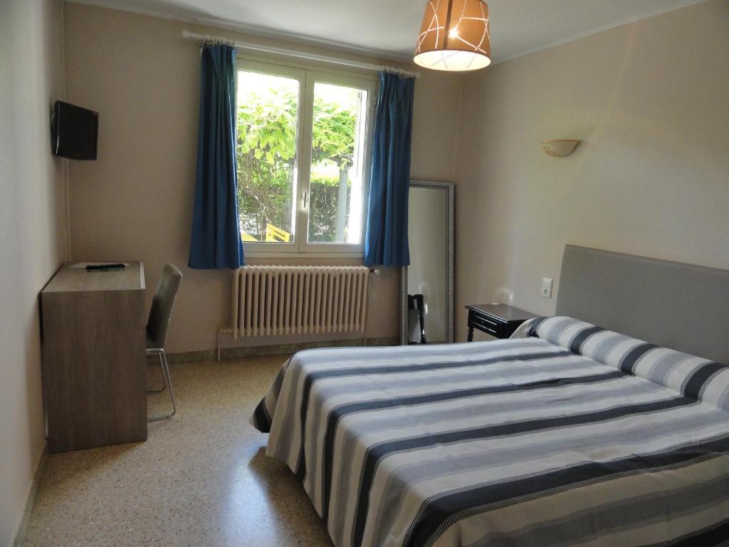 Postel nebo postele na pokoji v ubytování Hotel de l'île