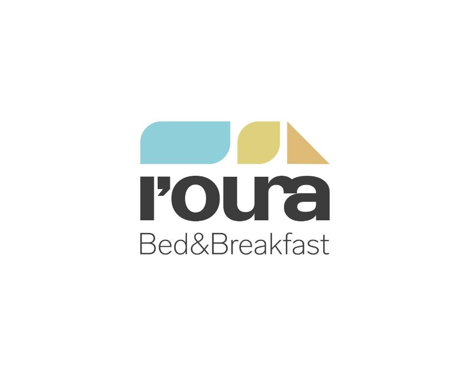 logotipo para un restaurante de desayunos en la playa en l'Oura B&B en Challand Saint Anselme