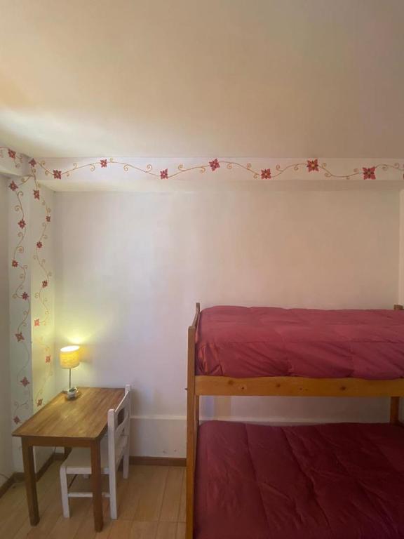 Postel nebo postele na pokoji v ubytování Hostal Chaska Wasi
