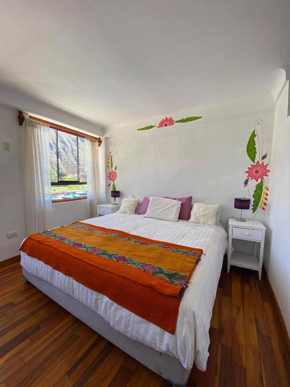 Postel nebo postele na pokoji v ubytování Hostal Chaska Wasi