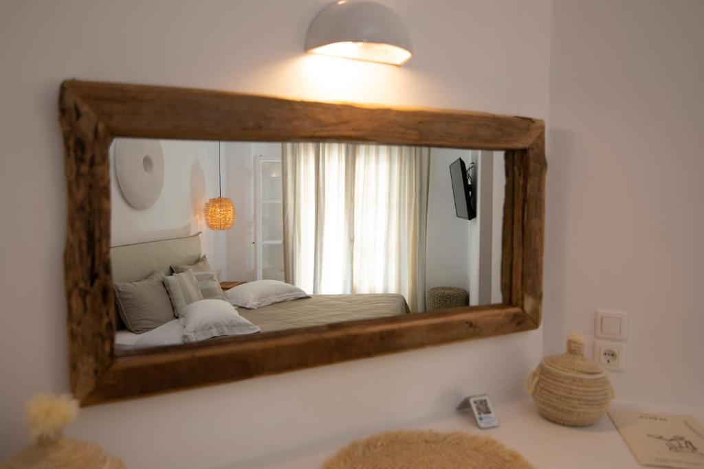 Postel nebo postele na pokoji v ubytování Nymfes Hotel