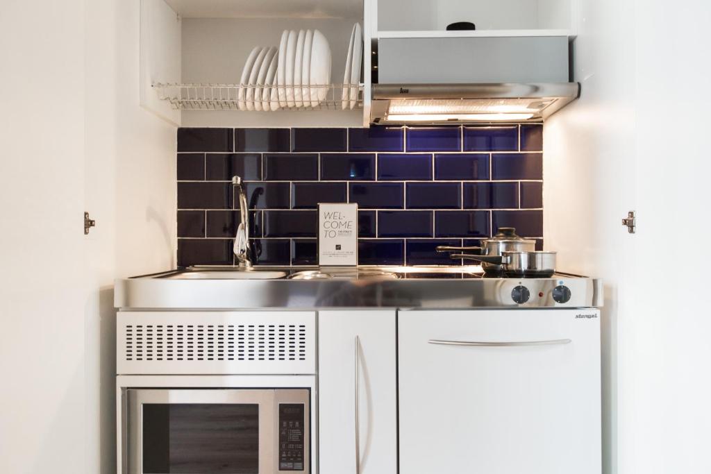 Kuchyňa alebo kuchynka v ubytovaní Barrio Gotico Apartments Ferran