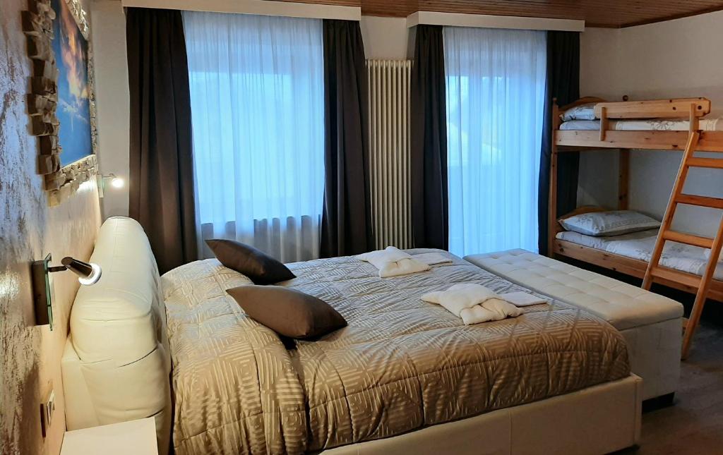 Postel nebo postele na pokoji v ubytování Albergo Vittoria