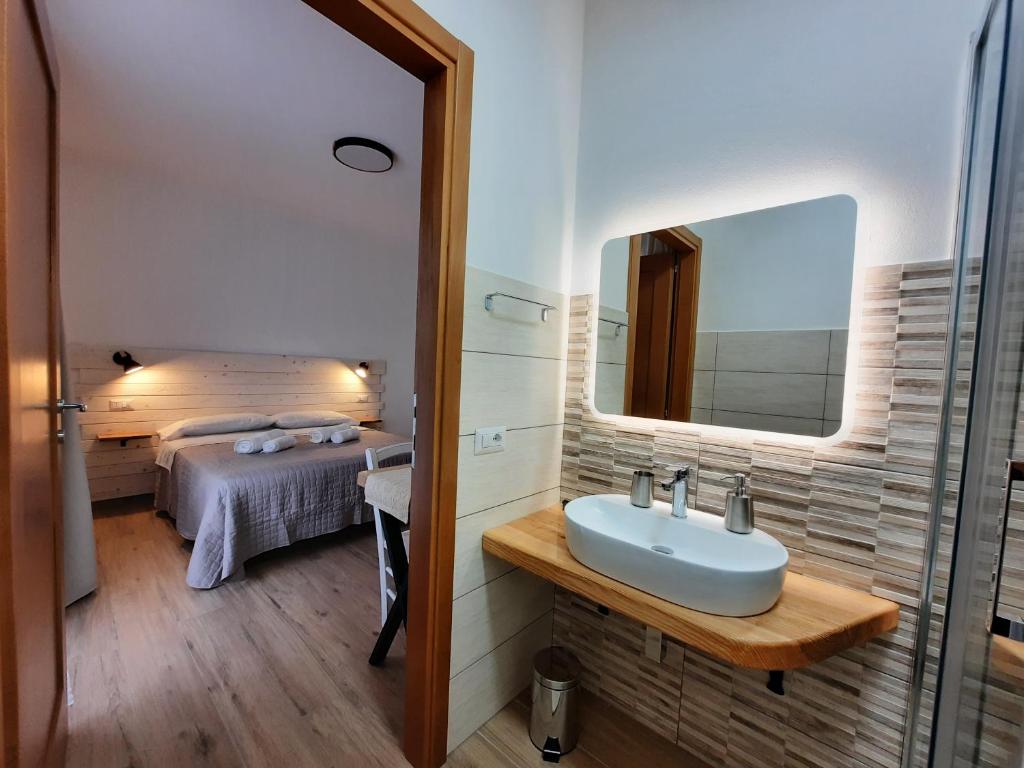 A bed or beds in a room at Affittacamere Su Maistu e Linna