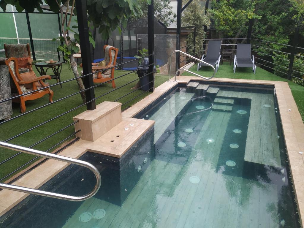 The swimming pool at or close to Posada Rural SPA Granja LA TEJERA de Lozoya