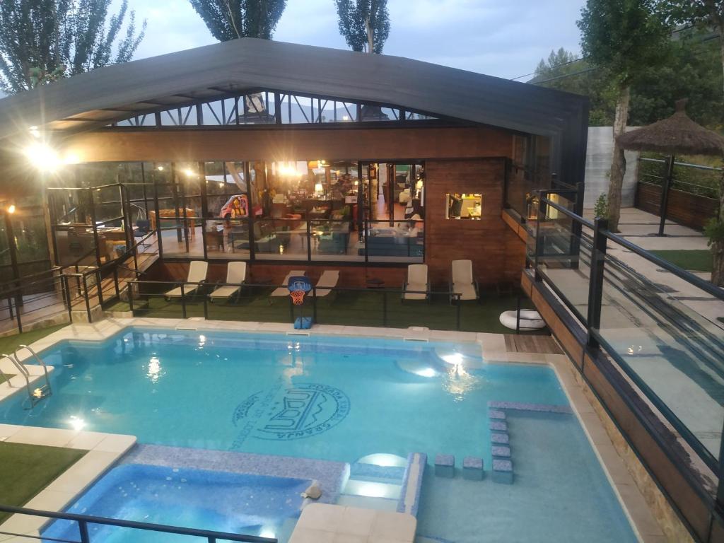 The swimming pool at or close to Posada Rural SPA Granja LA TEJERA de Lozoya