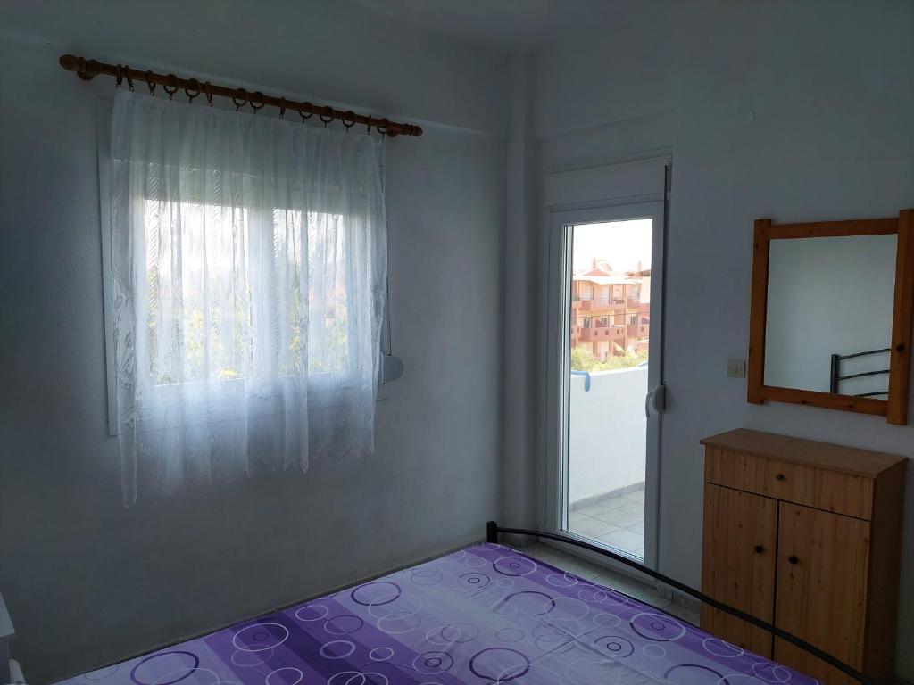 Postel nebo postele na pokoji v ubytování Lelegianni Studios and Apartments