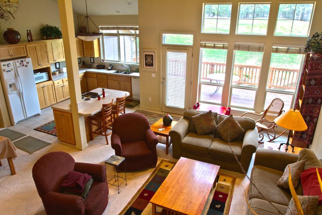 a living room with couches and a table and a kitchen at Widgi Creek #22 condo in Bend