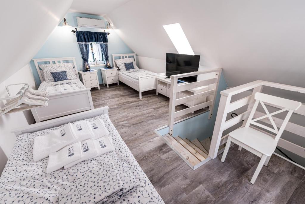 Postel nebo postele na pokoji v ubytování Apartmány Sklepy Mařatice