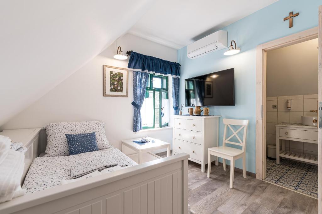 Postel nebo postele na pokoji v ubytování Apartmány Sklepy Mařatice