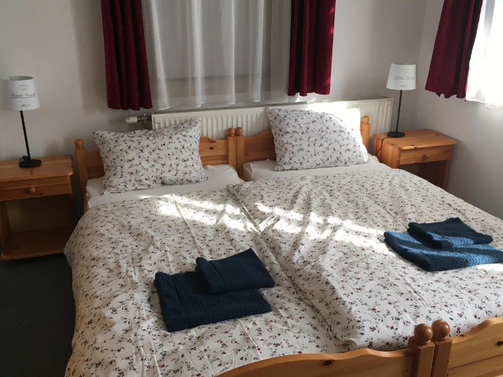 Posteľ alebo postele v izbe v ubytovaní Iris Vendégház