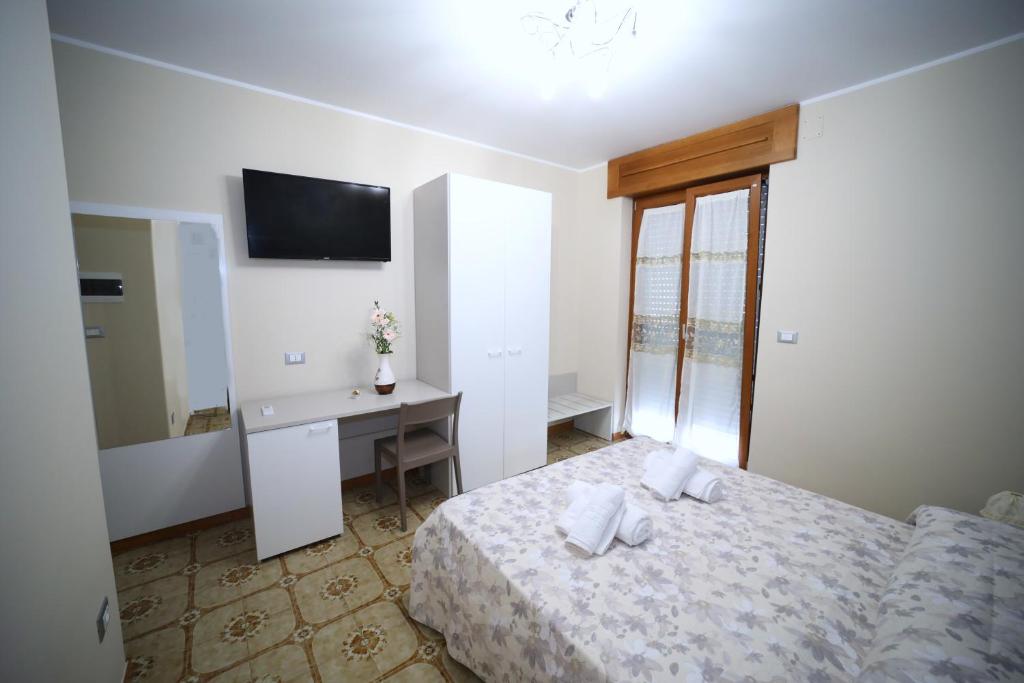 Łóżko lub łóżka w pokoju w obiekcie B&B Le Gorgonie