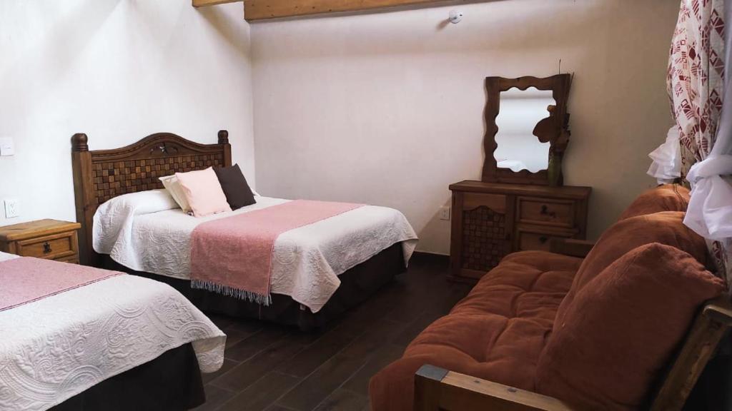 Postel nebo postele na pokoji v ubytování Cabañas los cactus 2