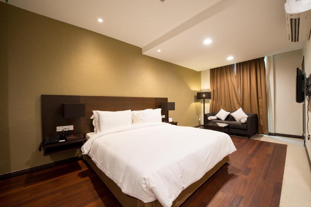Postel nebo postele na pokoji v ubytování Lazenda Hotel