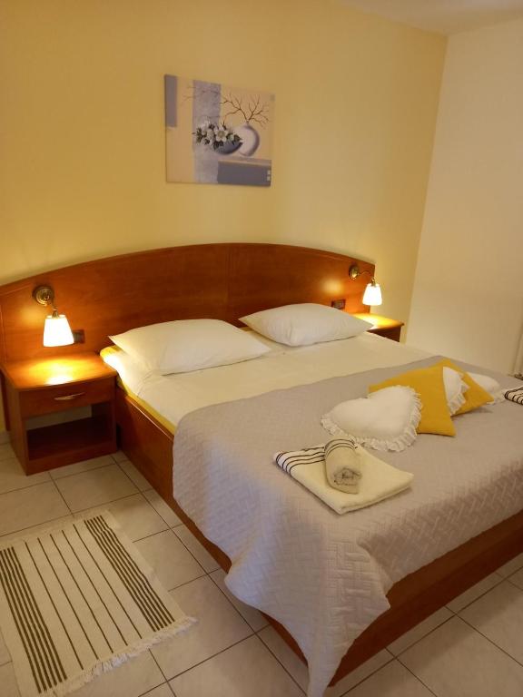 Postel nebo postele na pokoji v ubytování Apartman Katica