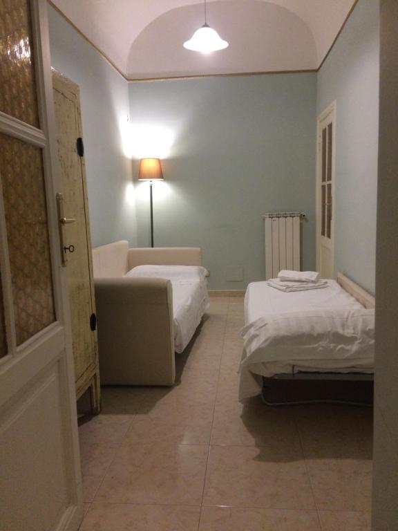 Posteľ alebo postele v izbe v ubytovaní Apt via cernaia center of rome