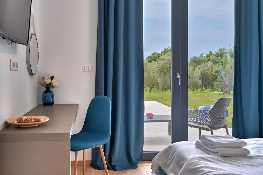 Łóżko lub łóżka w pokoju w obiekcie Villa Little Mo