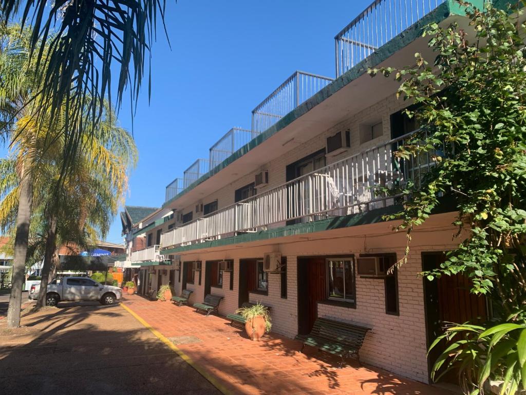 a building with a balcony on the side of it at Las Palmas del Daymán in Termas del Daymán