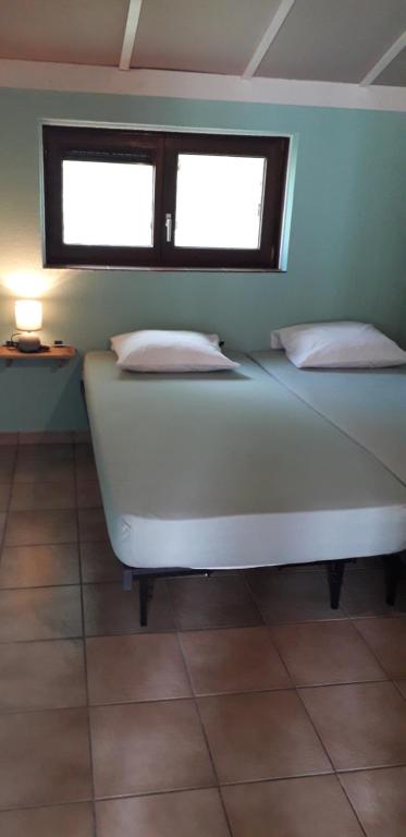 Postel nebo postele na pokoji v ubytování maison de dunes