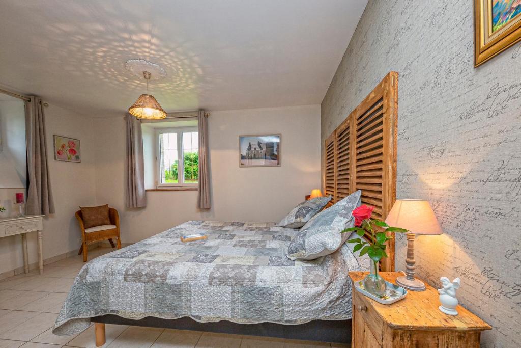 Postel nebo postele na pokoji v ubytování manoir de vauville