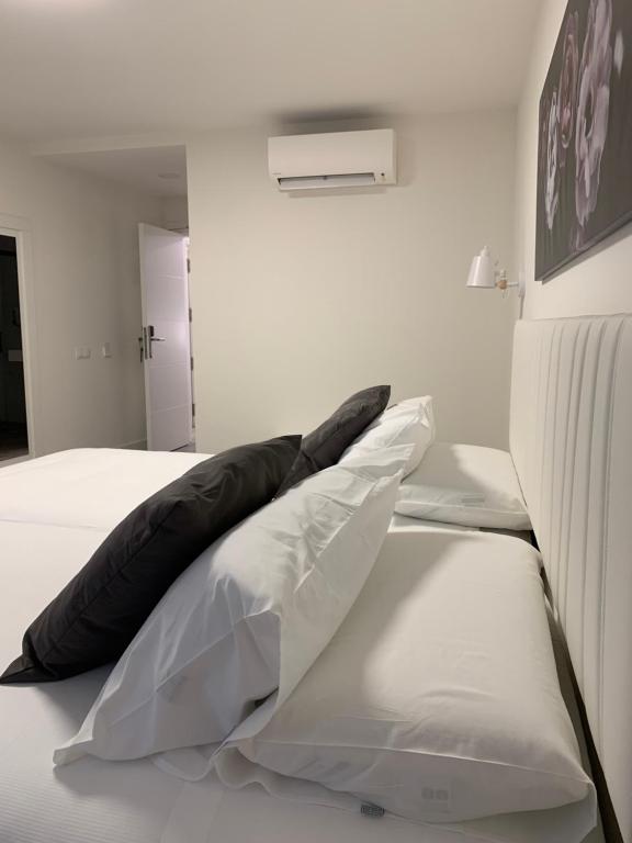 Postel nebo postele na pokoji v ubytování Hostal Comfort Suites