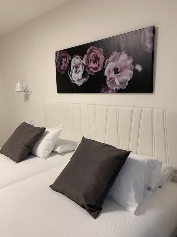 Postel nebo postele na pokoji v ubytování Hostal Comfort Suites