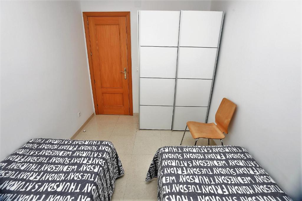 Posteľ alebo postele v izbe v ubytovaní Apartamento Plaça Jardí
