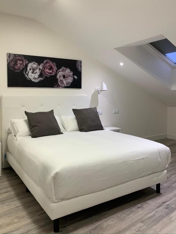 Postel nebo postele na pokoji v ubytování Hostal Comfort Suites
