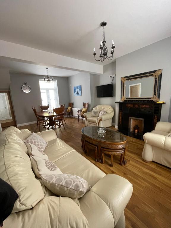 a living room with a couch and a table at Haven House in Derry Londonderry