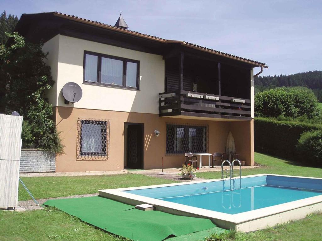 a house with a swimming pool in front of it at Apartment in Mölbling/Kärnten 69 in Althofen