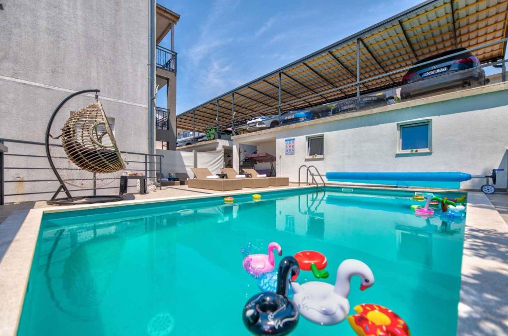 a swimming pool with toys in the water at One-Bedroom Apartment in Crikvenica LXXIX in Dramalj