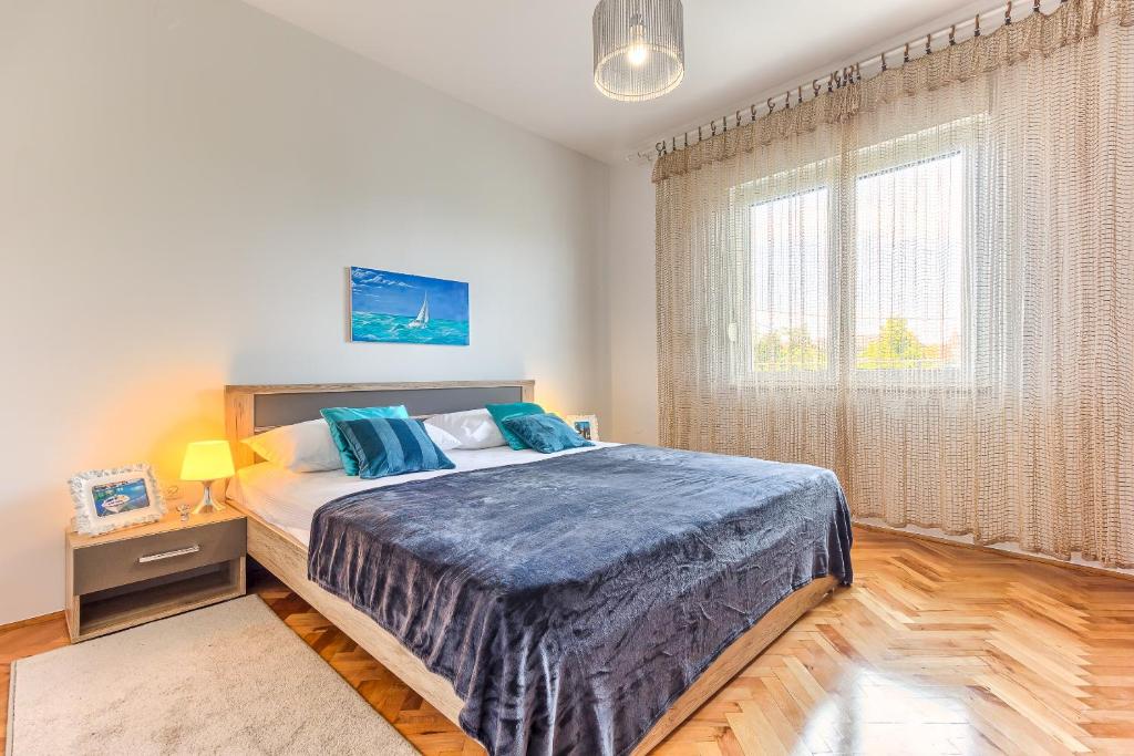 Posteľ alebo postele v izbe v ubytovaní Regent Apartment in Kastela