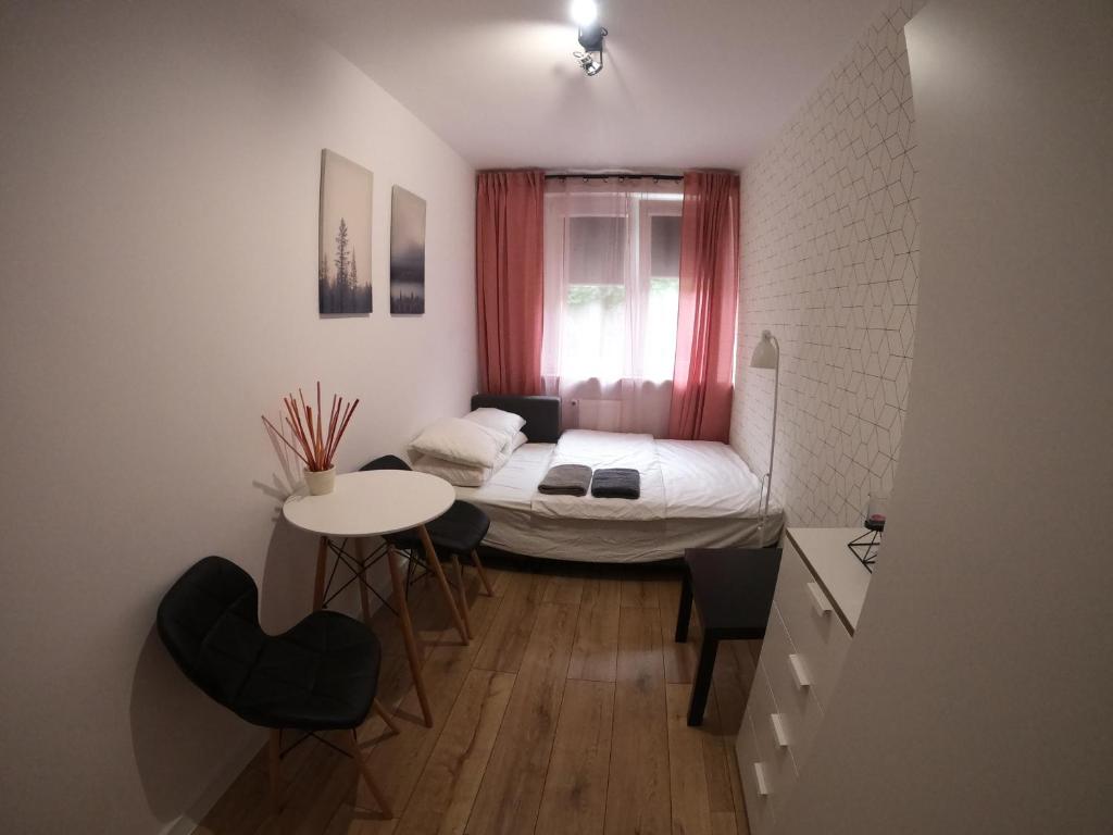 Posteľ alebo postele v izbe v ubytovaní APARTAMENT GDAŃSK ŚRÓDMIEŚCIE