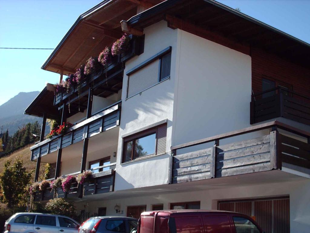 a building with cars parked in front of it at Apartment in Fulpmes/Tirol 711 in Fulpmes