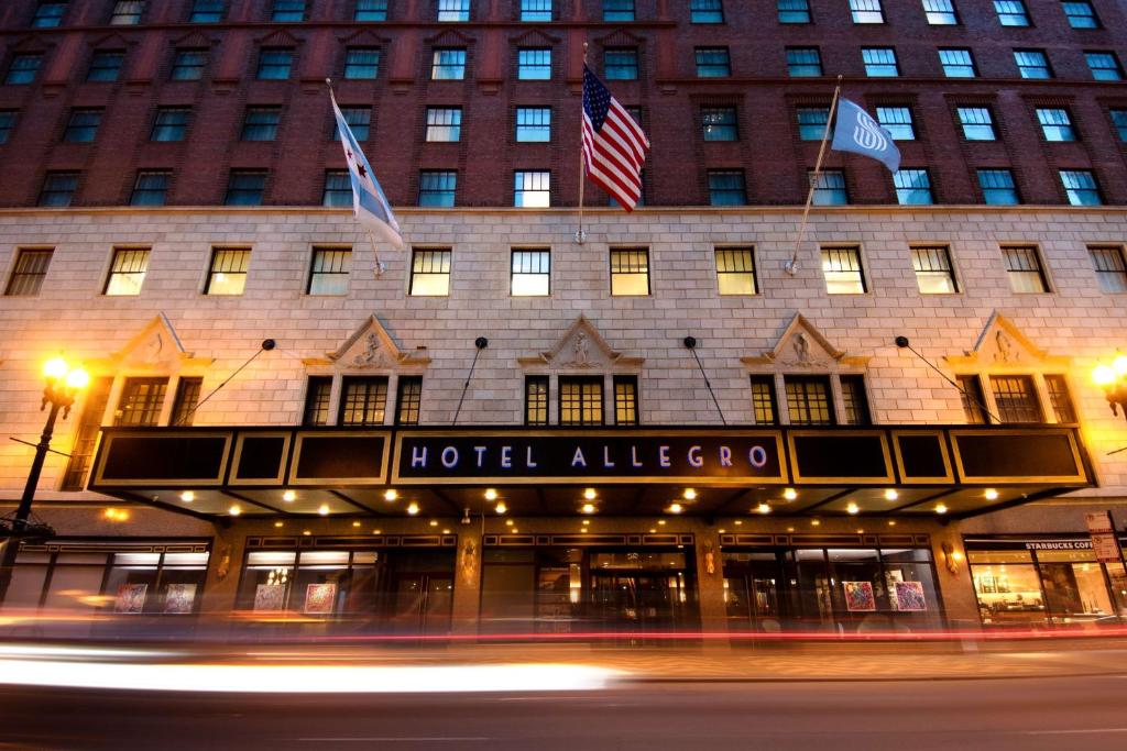a hotelallo allee building with american flags on it at The Allegro Royal Sonesta Hotel Chicago Loop in Chicago