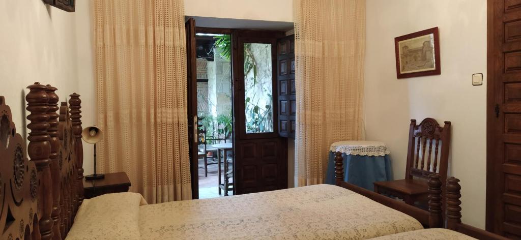 A bed or beds in a room at Hospedaje Octavio