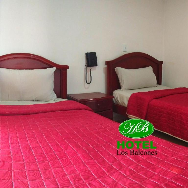 Postel nebo postele na pokoji v ubytování HOTEL LOS BALCONES