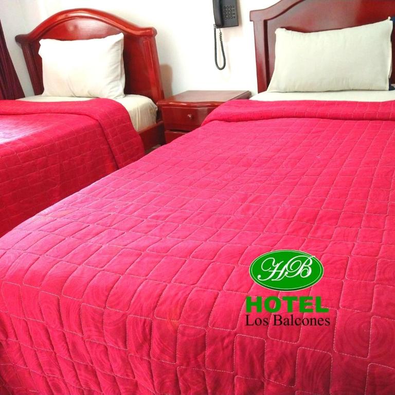 Postel nebo postele na pokoji v ubytování HOTEL LOS BALCONES