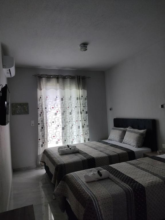 Łóżko lub łóżka w pokoju w obiekcie Mei's luxury apartments