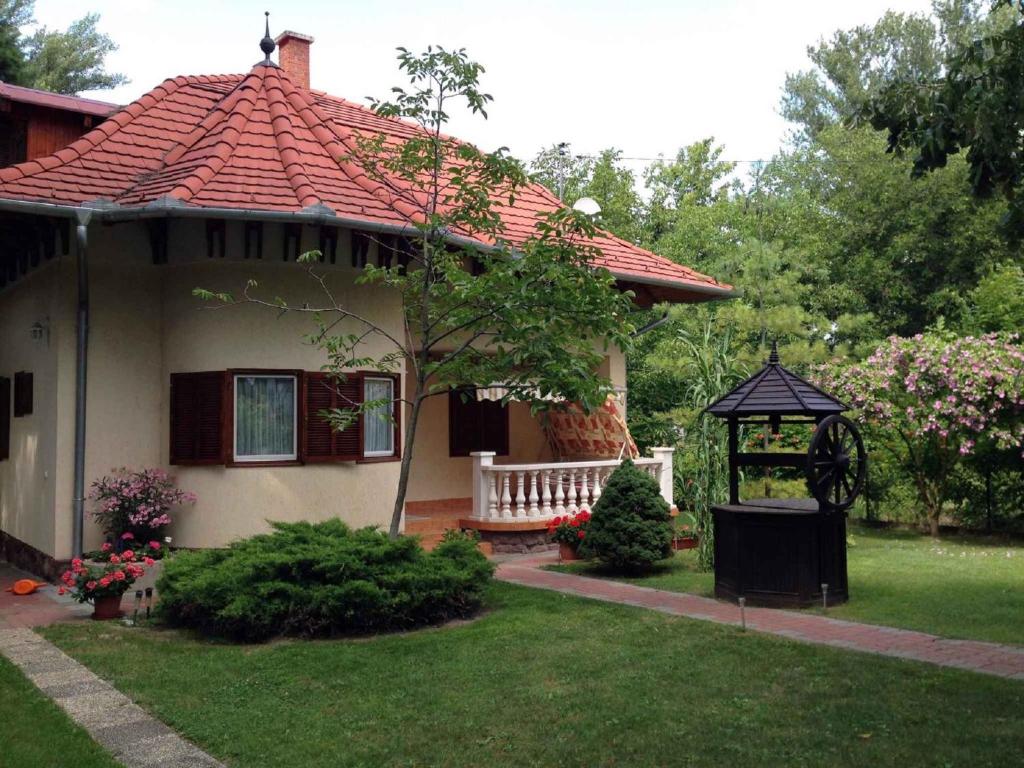 a small house with a gazebo in a yard at Apartment in Siofok/Balaton 19714 in Siófok