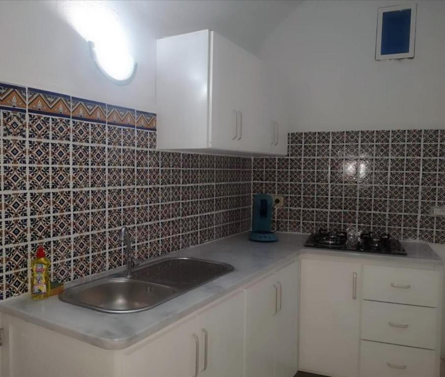 Virtuvė arba virtuvėlė apgyvendinimo įstaigoje Nouveau Bungalow Djerba