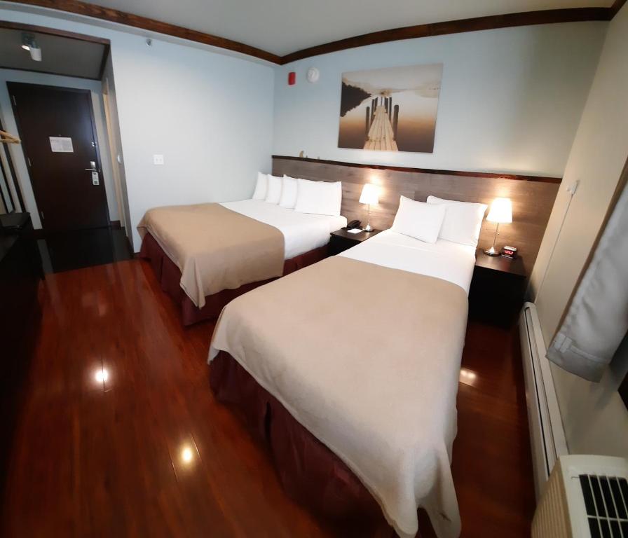 Ein Bett oder Betten in einem Zimmer der Unterkunft LIC Hotel