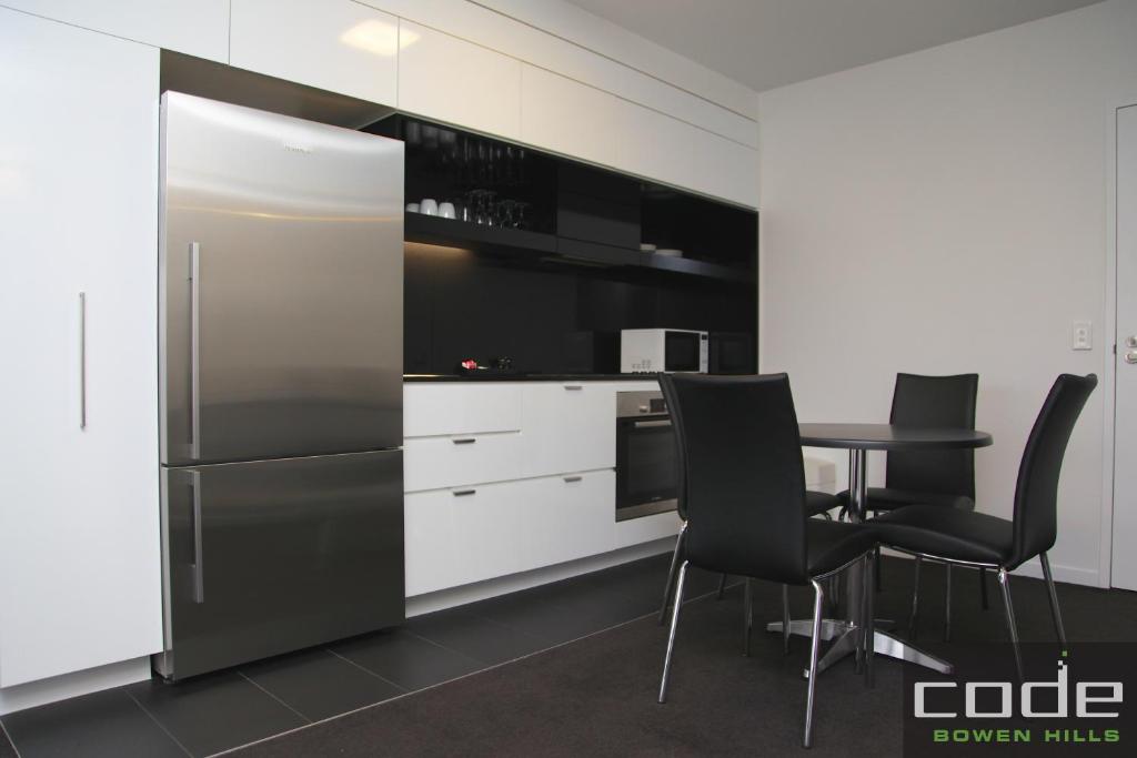 Kuchyň nebo kuchyňský kout v ubytování Code Apartments