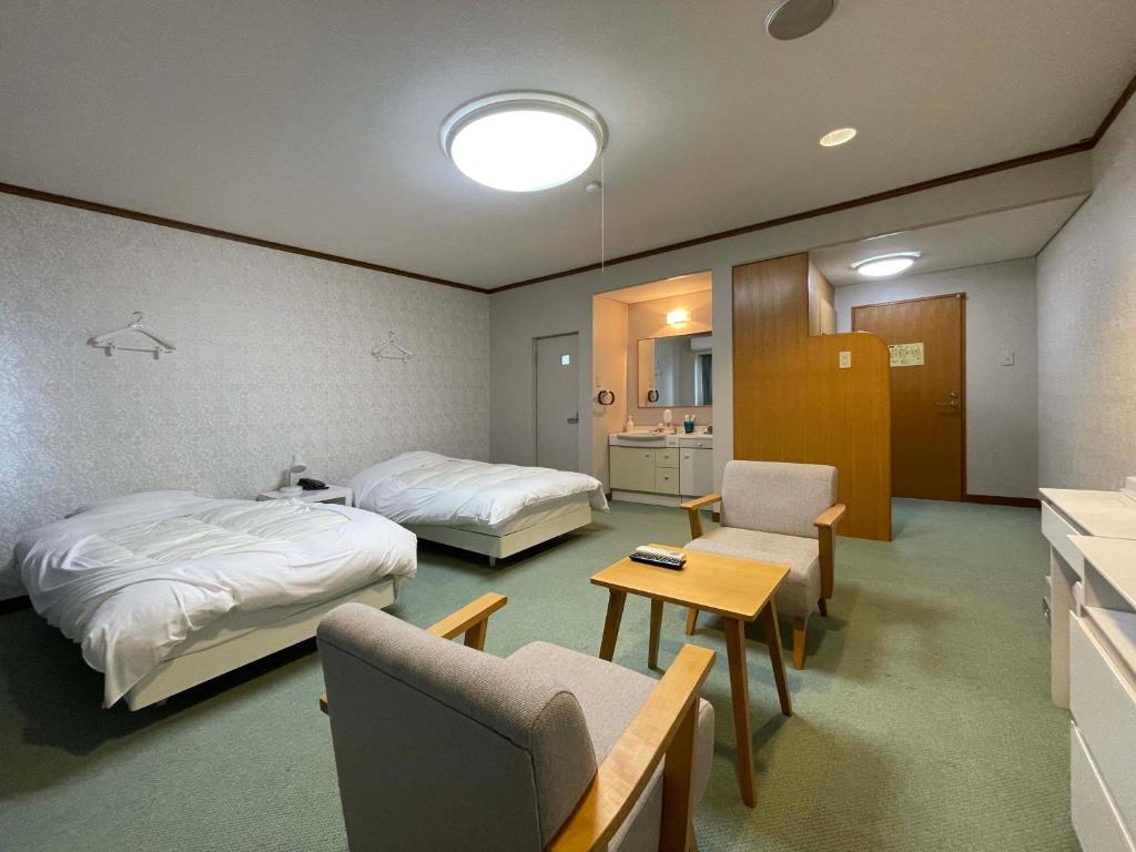 Postel nebo postele na pokoji v ubytování Marina Hotel Kaikuu