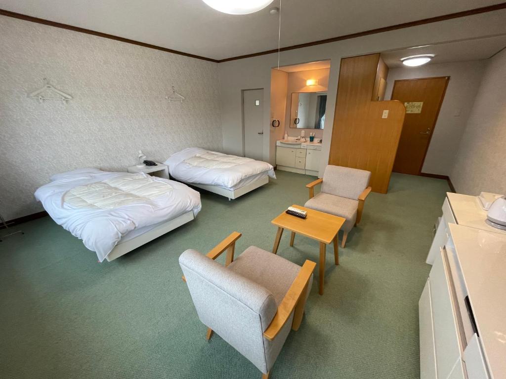 Postel nebo postele na pokoji v ubytování Marina Hotel Kaikuu