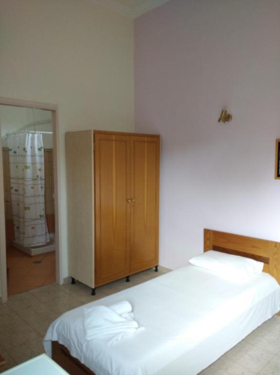 Postel nebo postele na pokoji v ubytování Hotel Ion