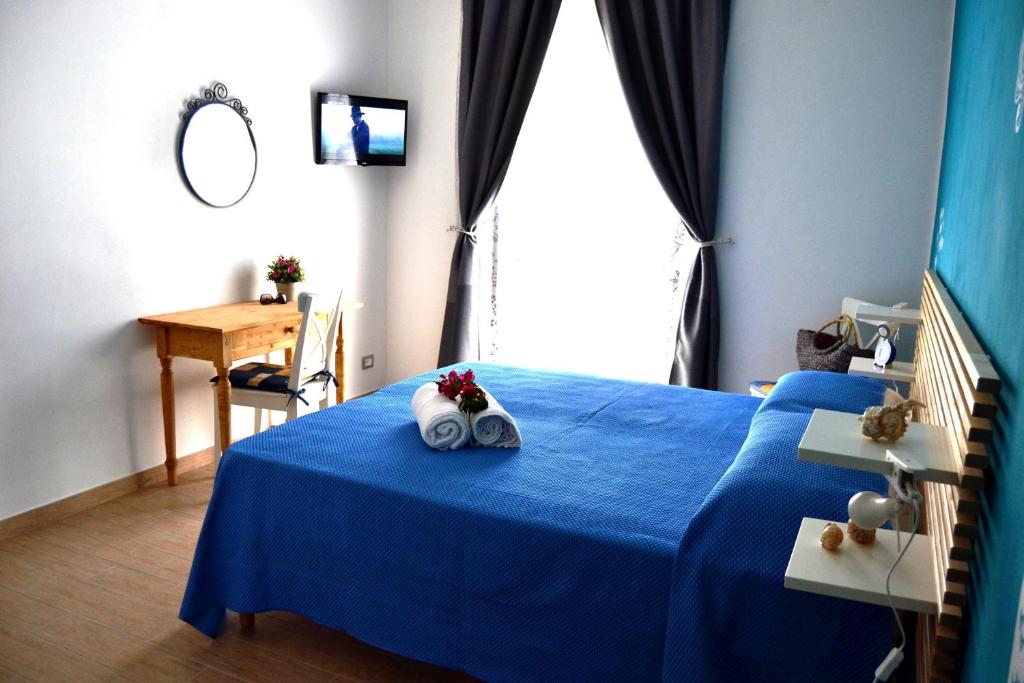Posteľ alebo postele v izbe v ubytovaní B&B Vivere il Mare