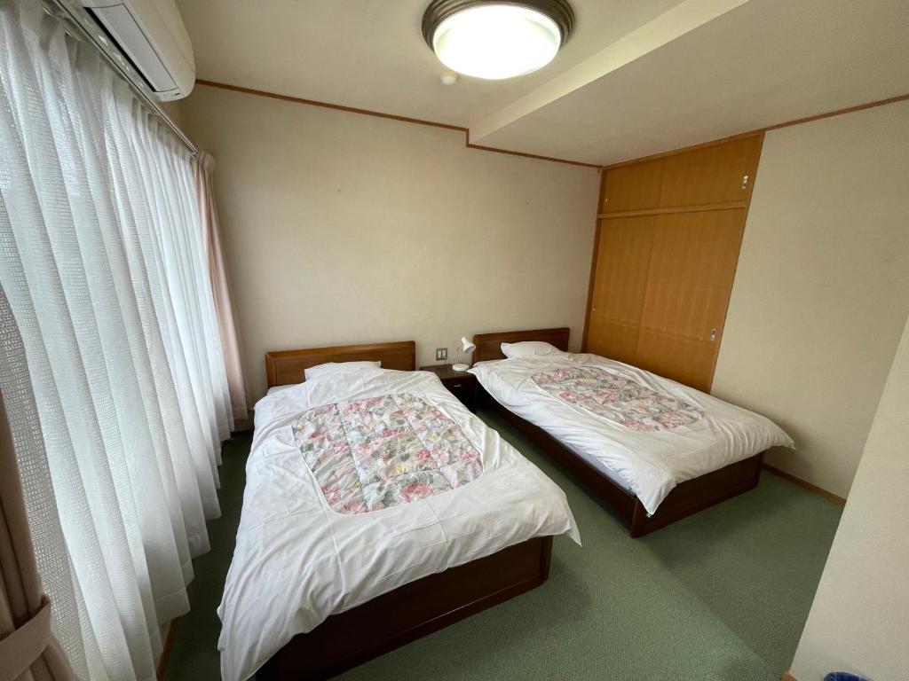 Postel nebo postele na pokoji v ubytování Marina Hotel Kaikuu