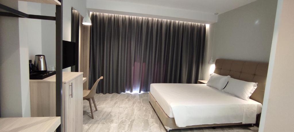 Postel nebo postele na pokoji v ubytování Sonia Hotel & Suites