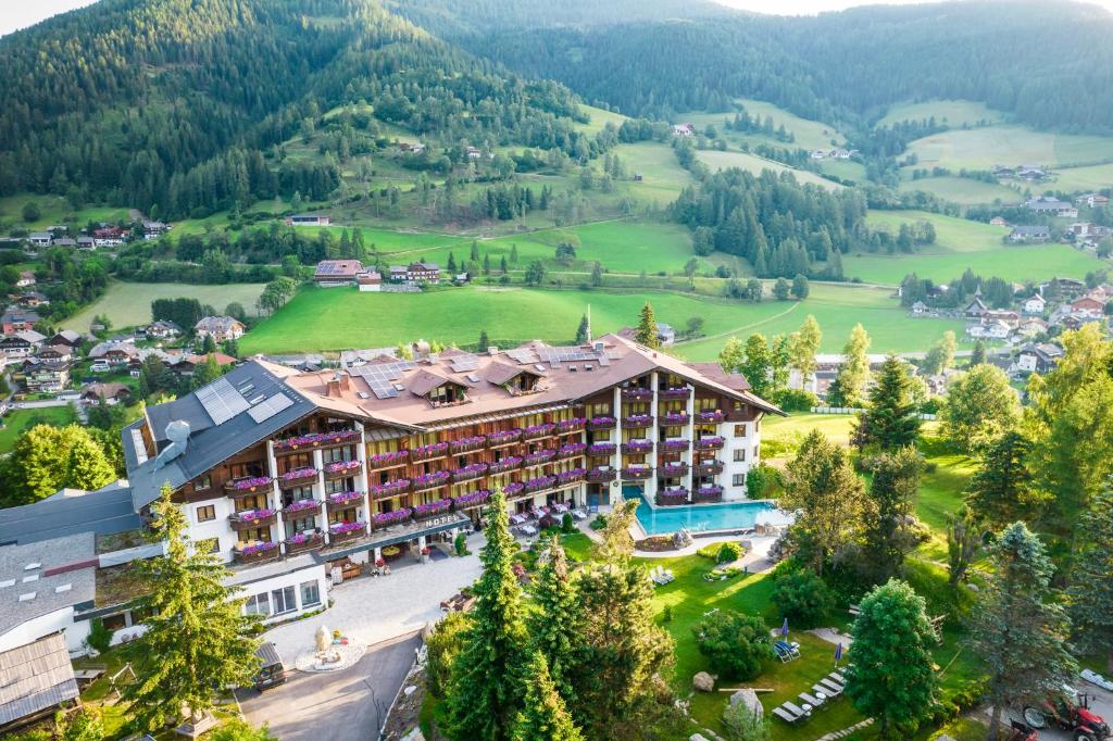 an aerial view of a hotel in the mountains at Der Kirchheimerhof - Superior in Bad Kleinkirchheim